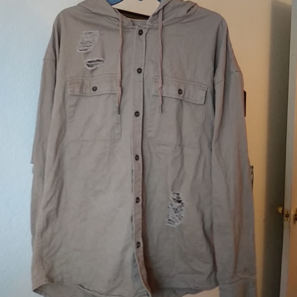 Beige/tan color distressed button down shirt.